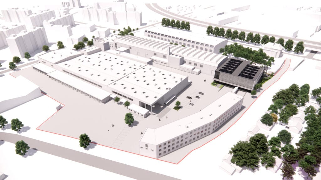 Leasing - Feevr 4 Vogelperspektive auf modernes Industriegebiet mit Gebäuden, Parkplätzen und Bäumen im städtischen Umfeld.